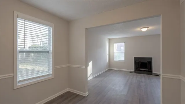 a view of an empty room with a window