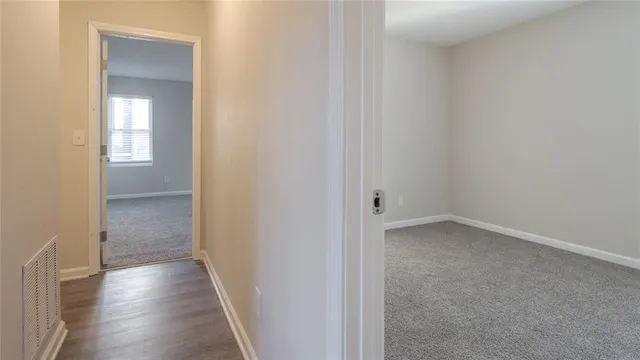 a bathroom with a granite countertop toilet and a shower