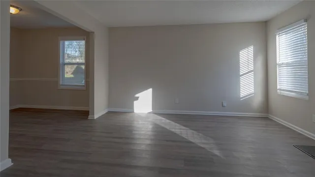 a view of hallway with wooden floor