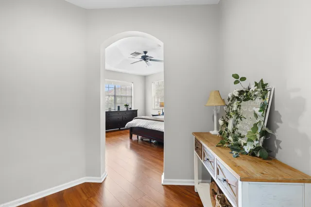 a living room with furniture and a mirror