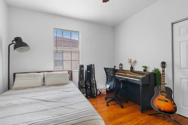 a bedroom with furniture and a window