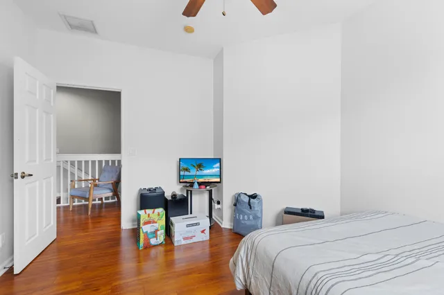 a bedroom with bed and a table