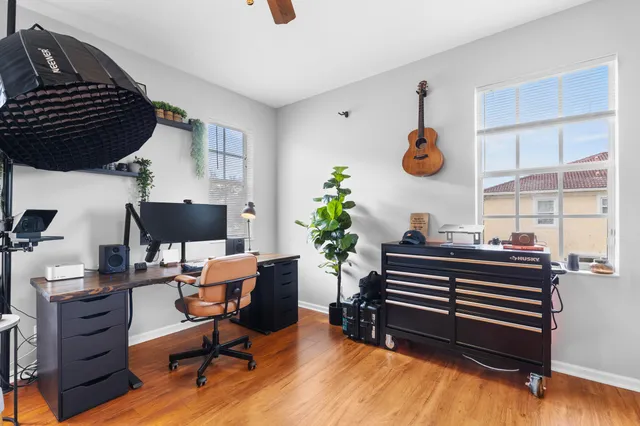 a livingroom with furniture and a potted plant