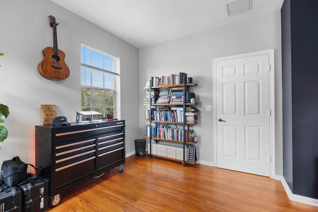 a view of room with toys and wooden floor