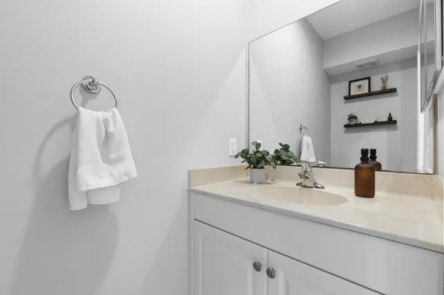 a bathroom with a sink and vanity