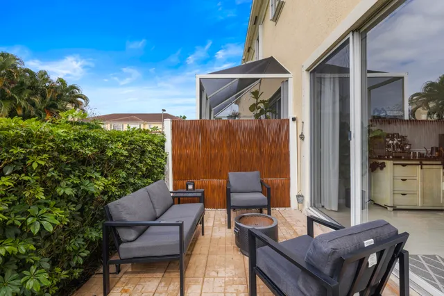 a outdoor space with patio the couches and a potted plant on the table