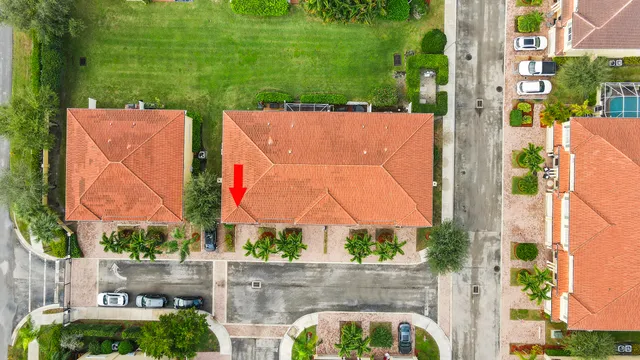 an aerial view of residential house with outdoor space and swimming pool