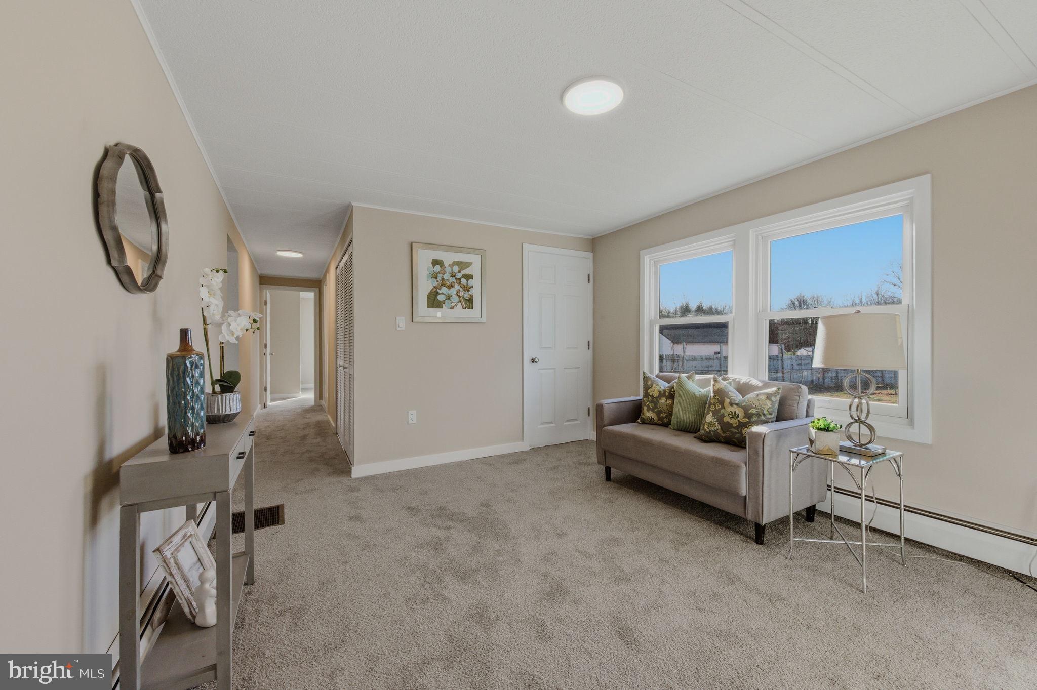 946 Vandyke Greenspring Road Townsend, DE 19734 - Photo 14 of 32 a living room with furniture and a mirror