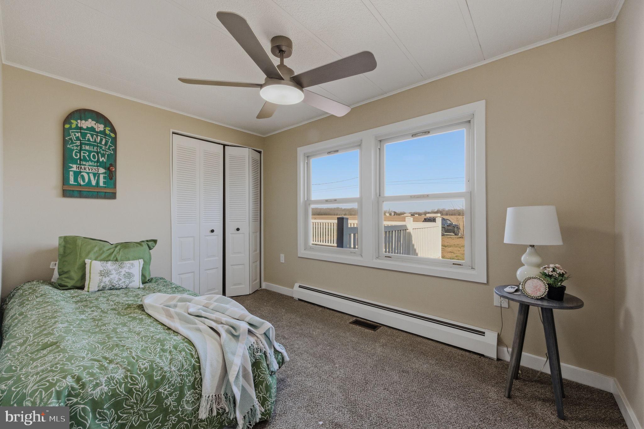 946 Vandyke Greenspring Road Townsend, DE 19734 - Photo 21 of 32 a bedroom with a bed and a window