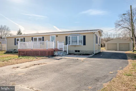 a view of a house with a snow in the yard