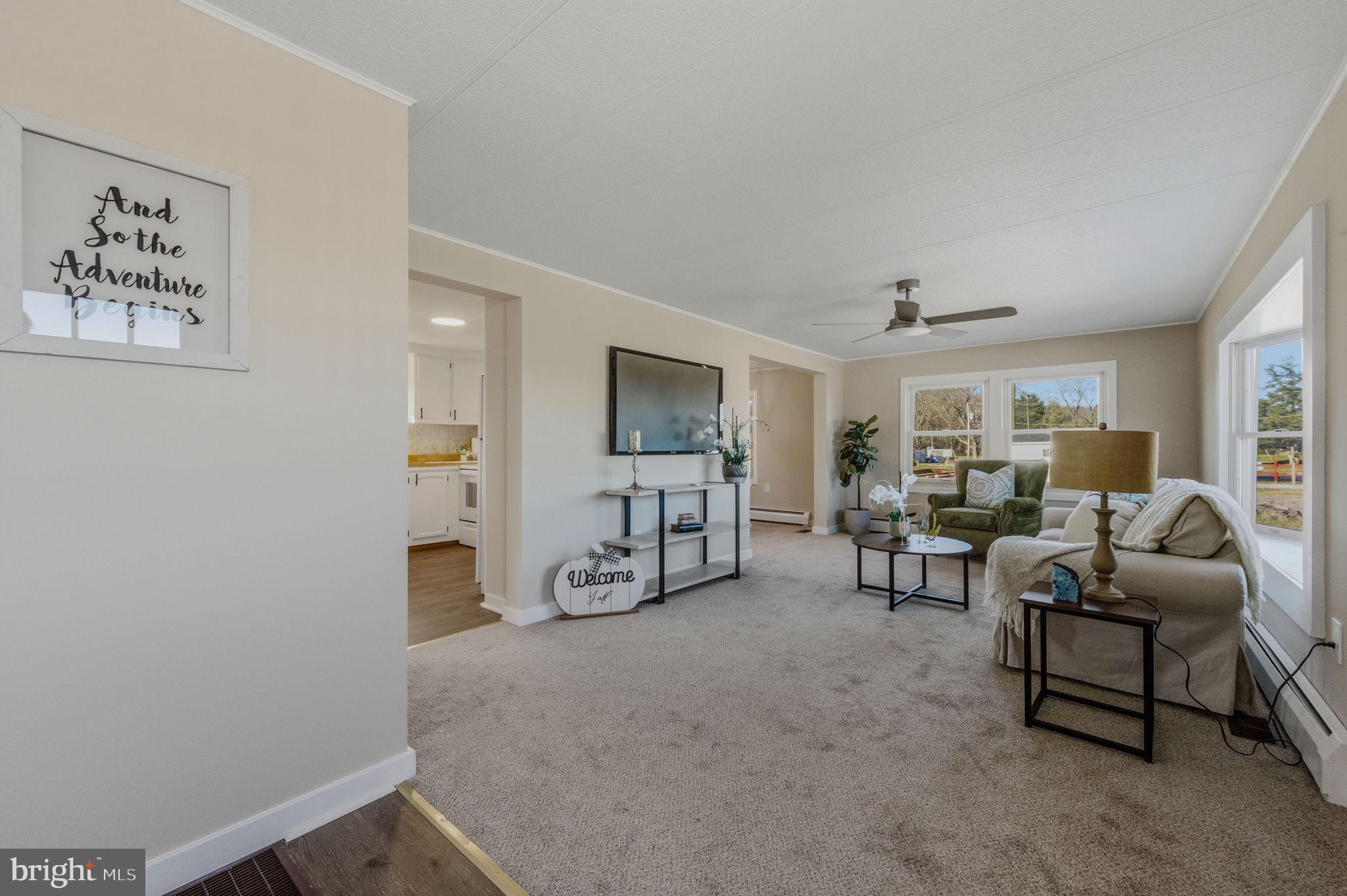 946 Vandyke Greenspring Road Townsend, DE 19734 - Photo 4 of 32 a living room with furniture and a flat screen tv