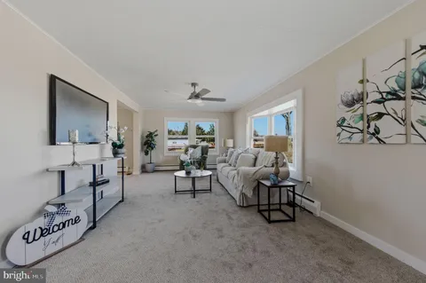 a living room with furniture and a table