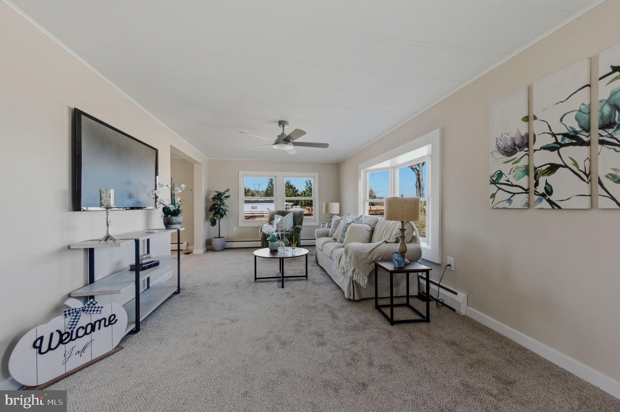 946 Vandyke Greenspring Road Townsend, DE 19734 - Photo 5 of 32 a living room with furniture and a table