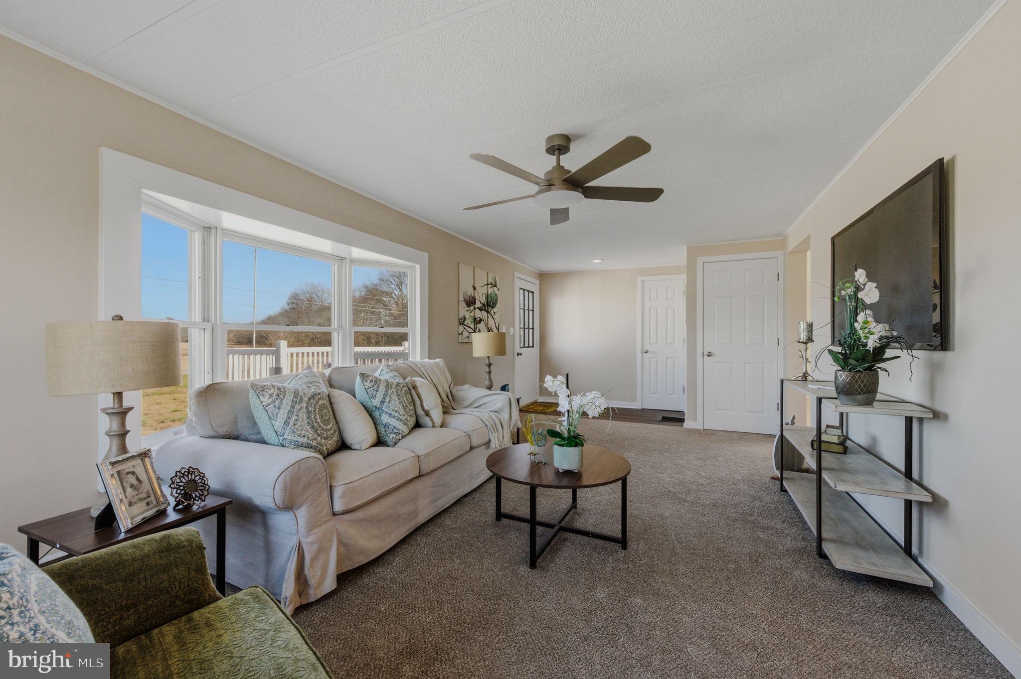 946 Vandyke Greenspring Road Townsend, DE 19734 - Photo 6 of 32 a living room with furniture and a large window