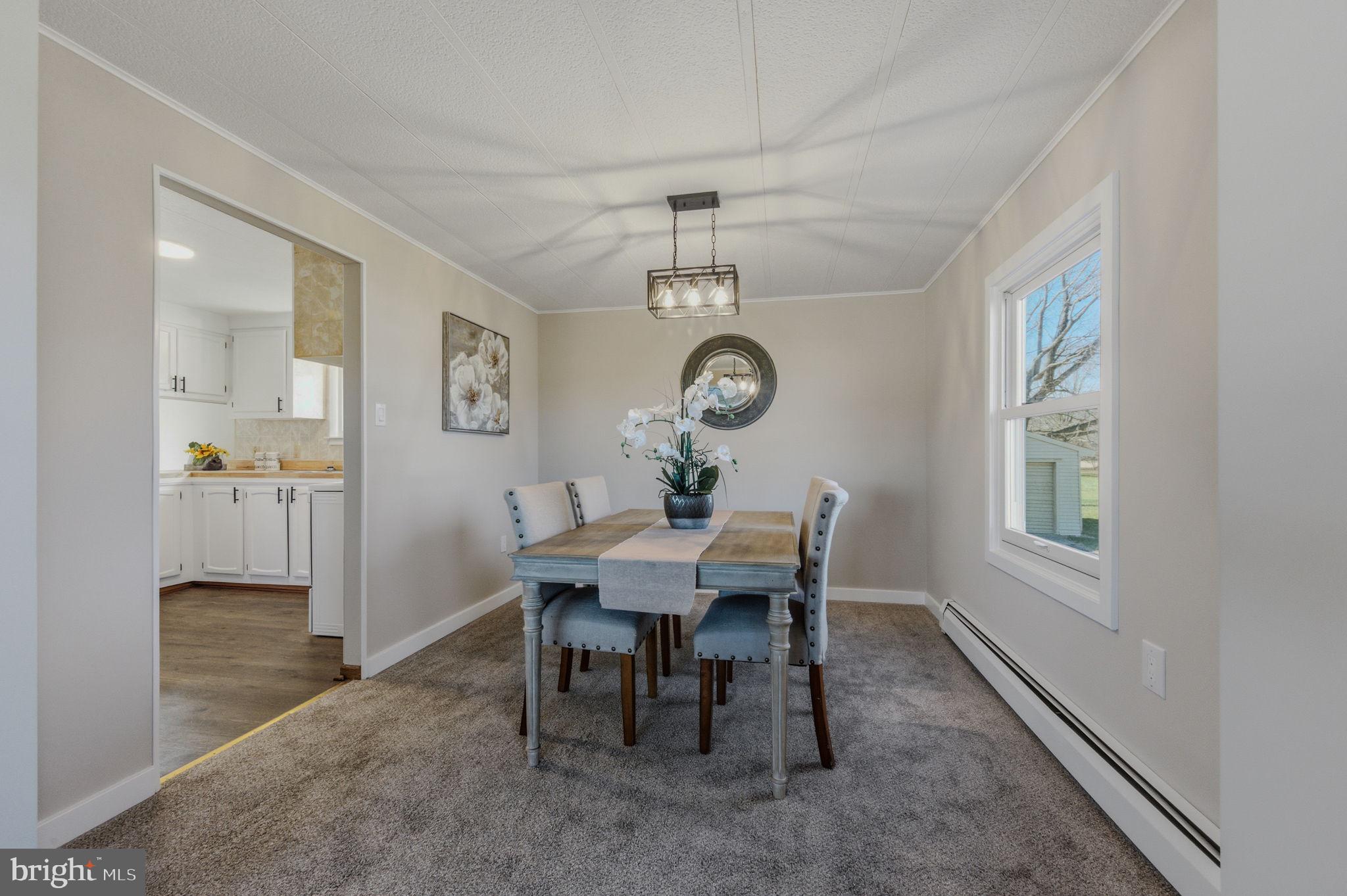 946 Vandyke Greenspring Road Townsend, DE 19734 - Photo 7 of 32 a view of a dining room with a table and chairs