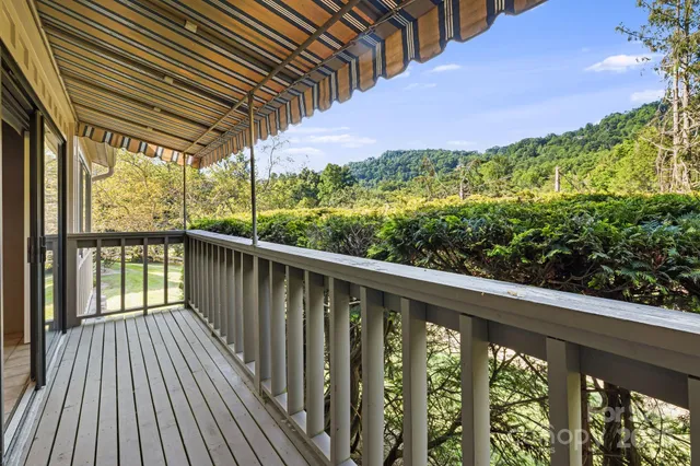 a spacious bedroom with a bed and a window