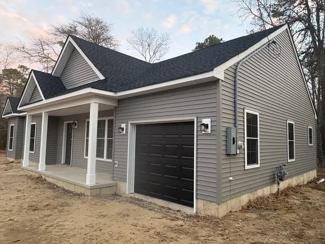 a view of a house with a garage