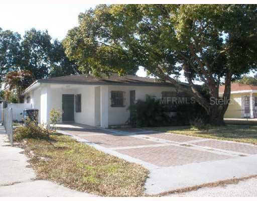 3312 West Braddock Street Tampa, FL 33607 - Photo 1 of 1 a view of house with outdoor space and trees in the background
