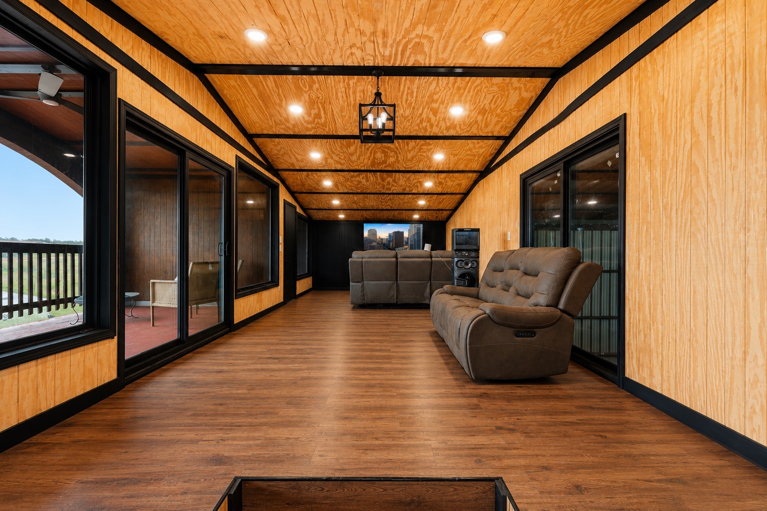 1701 County Road 466 Elgin, TX 78621 - Photo 6 of 24 Hardwood floors and bright recessed lighting adorn this spacious entertainment area.