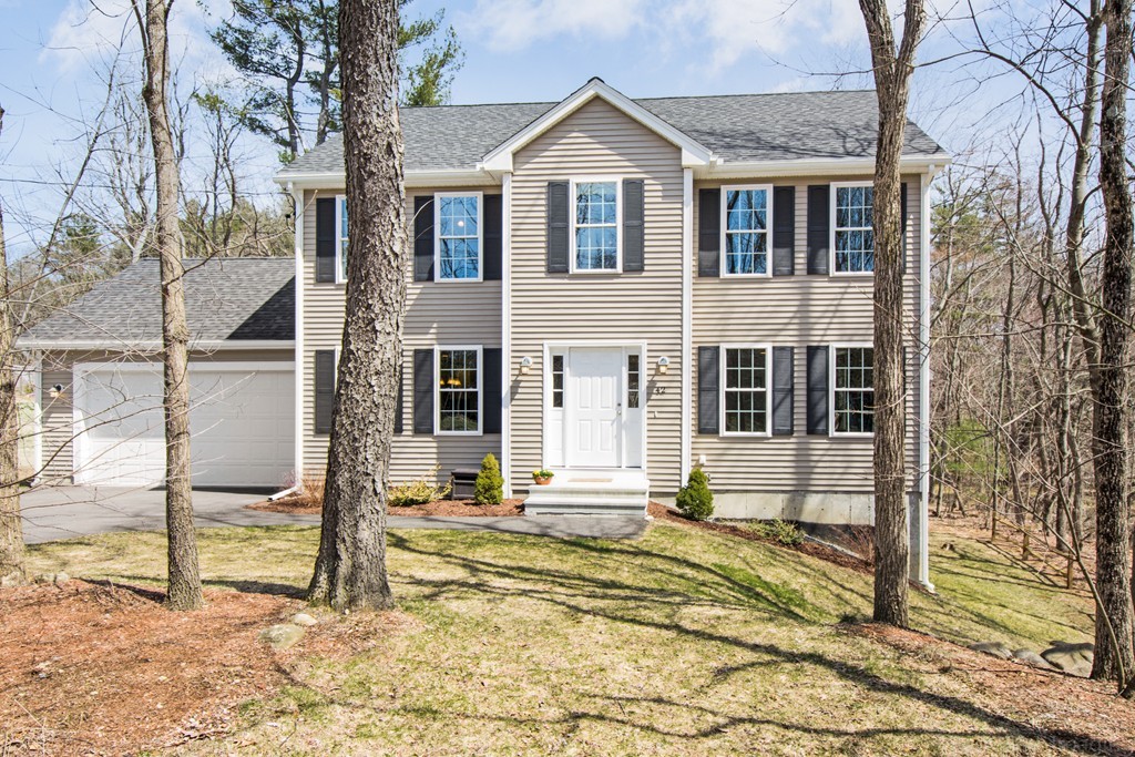 42 White Pond Road Stow, MA 01775 - Photo 1 of 26 a front view of a house with a porch