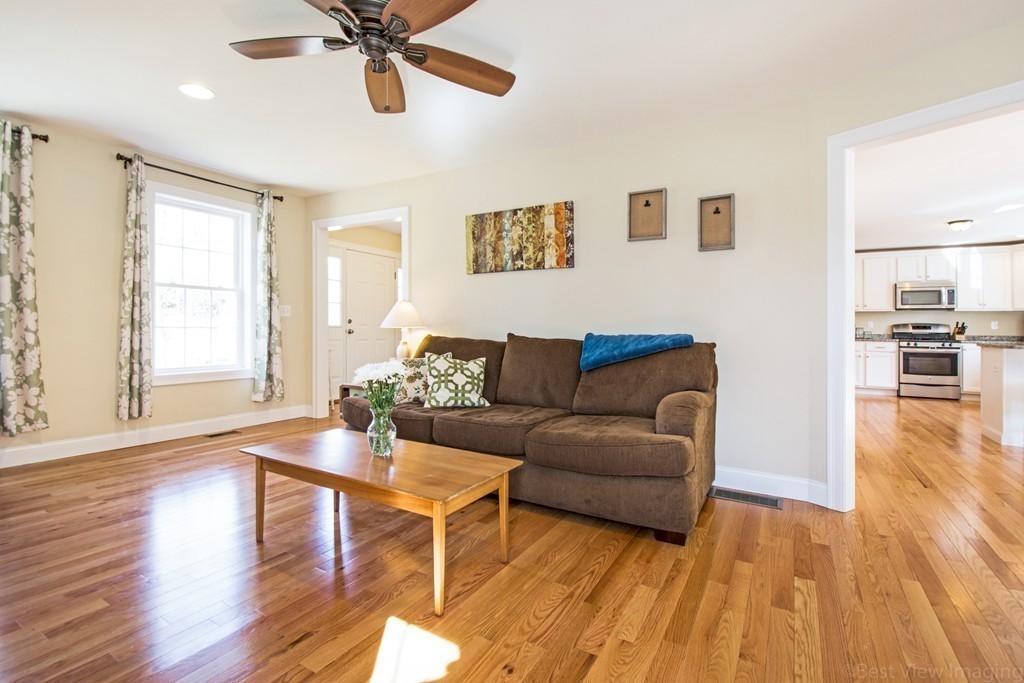 42 White Pond Road Stow, MA 01775 - Photo 5 of 26 a living room with furniture and a wooden floor