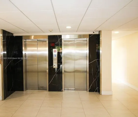 a kitchen with a refrigerator and microwave