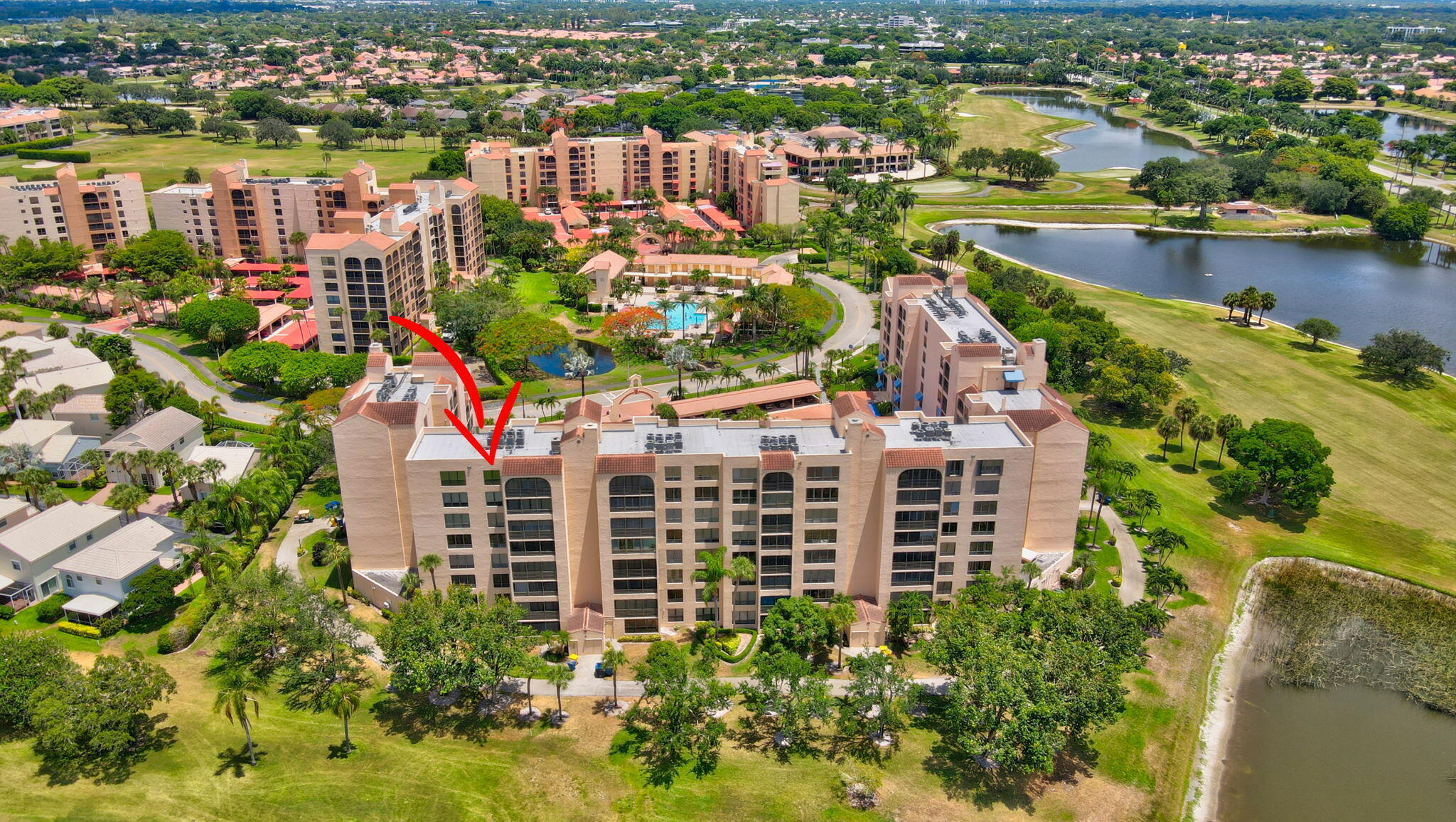 7194 Promenade Drive, Unit 102 Boca Raton, FL 33433 - Photo 44 of 56 an aerial view of lake and residential houses with outdoor space