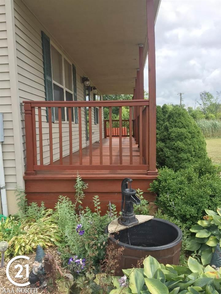 15724 Donald Road Capac, MI 48014 - Photo 7 of 48 long sitting porch