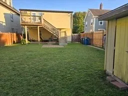 a view of a house with a backyard