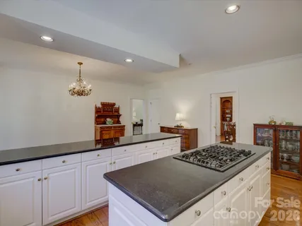 a kitchen with a stove and a sink