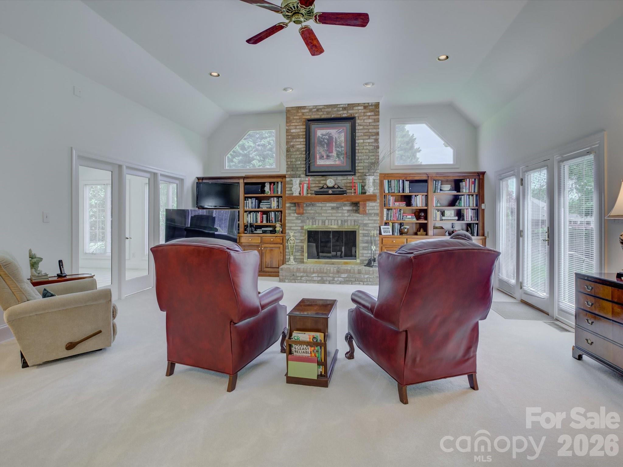 2980 Robinwood Road Gastonia, NC 28054 - Photo 16 of 48 a living room with furniture and a fireplace