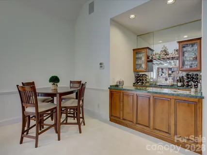 a view of a dining room with furniture and window