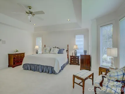 a bedroom with bed and window