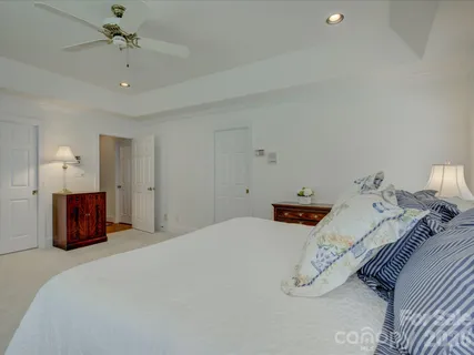 a bedroom with bed and window