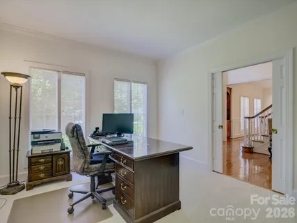 a workspace with furniture and a window