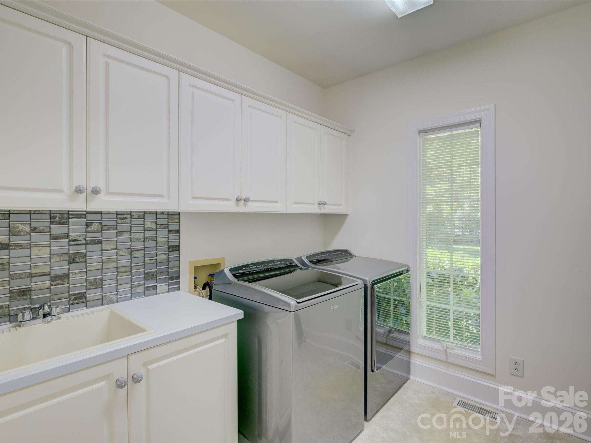 2980 Robinwood Road Gastonia, NC 28054 - Photo 27 of 48 a utility room with sink dryer and washer