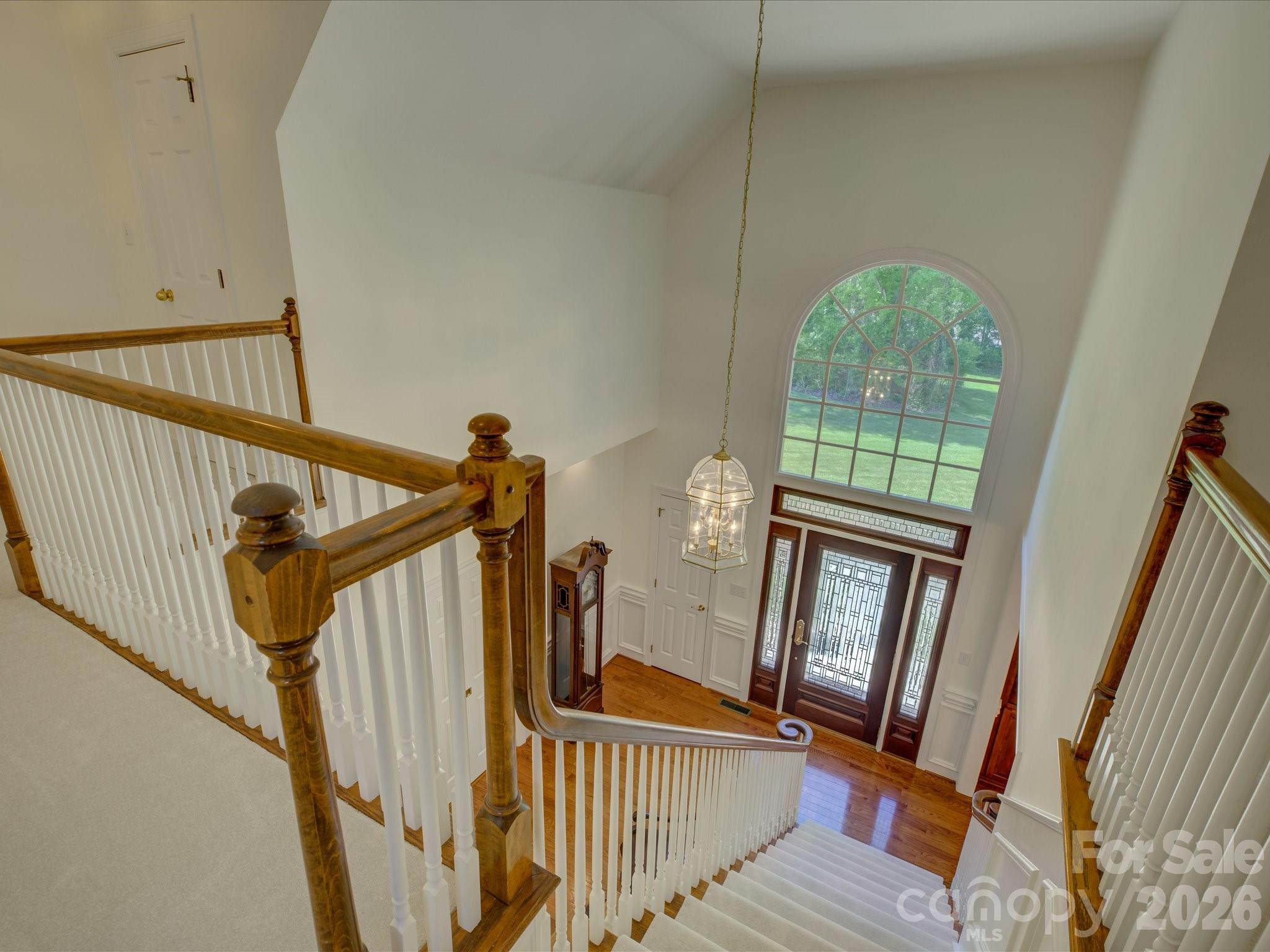 2980 Robinwood Road Gastonia, NC 28054 - Photo 29 of 48 a view of staircase with railing and a floor to ceiling window