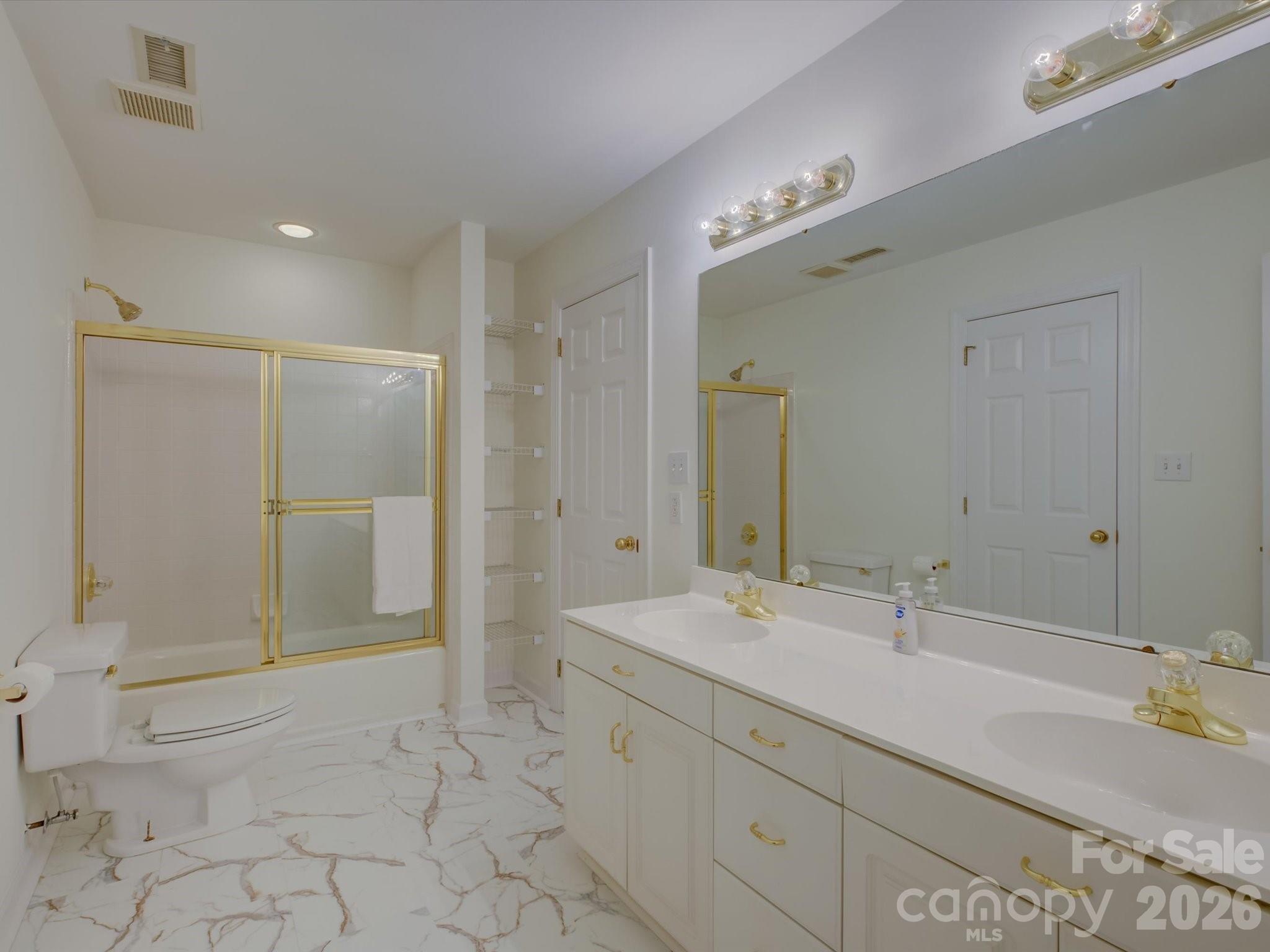 2980 Robinwood Road Gastonia, NC 28054 - Photo 37 of 48 a bathroom with a double vanity sink mirror and shower
