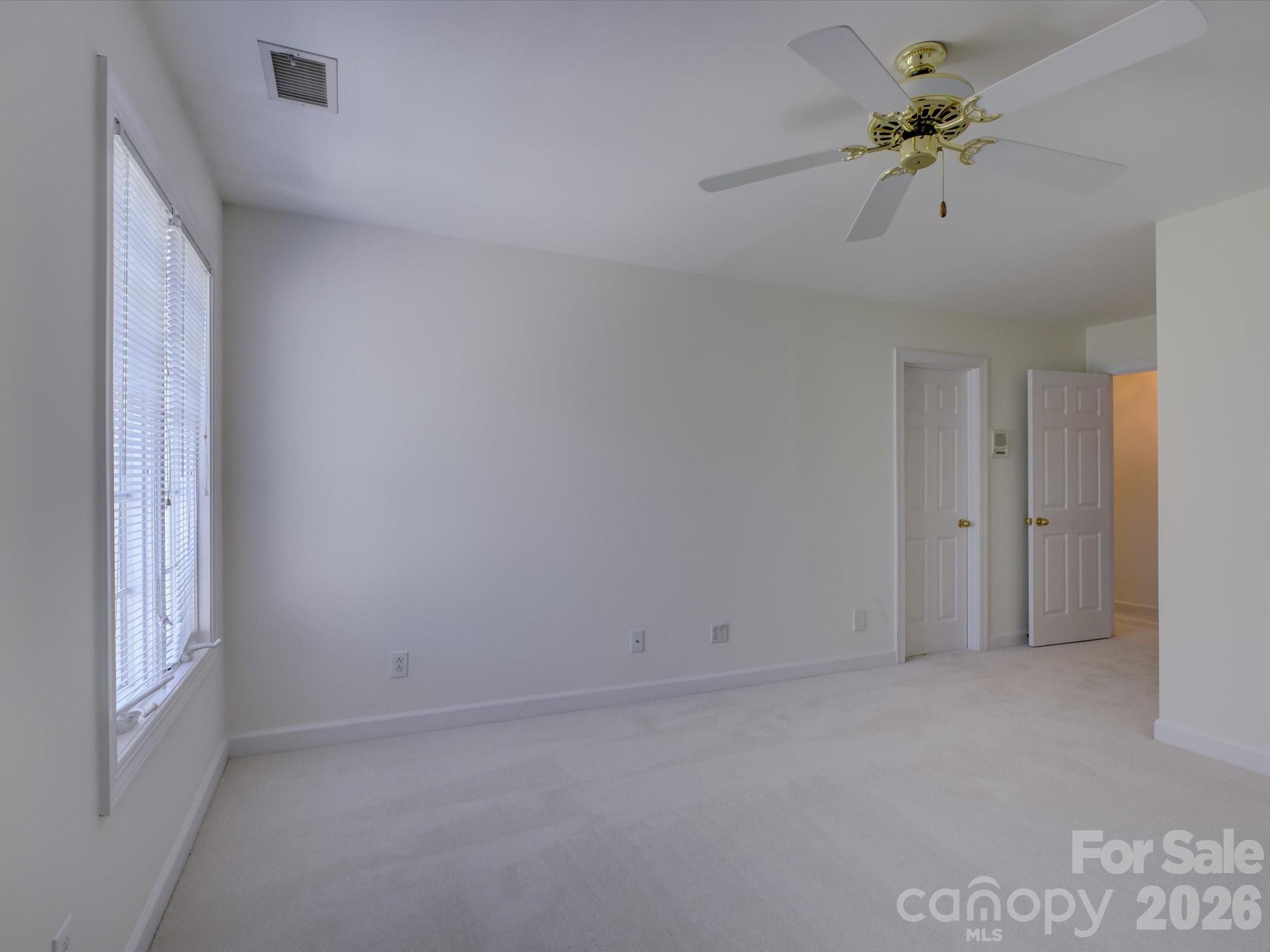 2980 Robinwood Road Gastonia, NC 28054 - Photo 39 of 48 a view of room with a ceiling fan and a window
