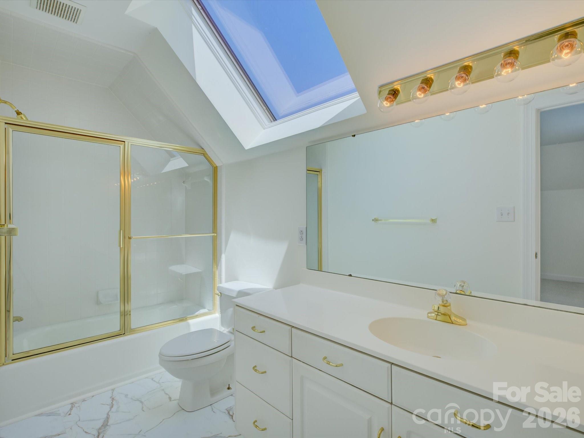 2980 Robinwood Road Gastonia, NC 28054 - Photo 42 of 48 a bathroom with a sink a toilet and shower
