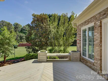 a view of a patio with couches and potted plants