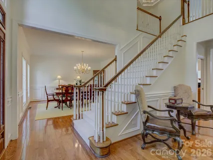 a view of entryway dining room and hall with wooden floor