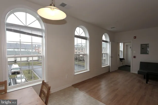 a view of a livingroom with furniture and windows