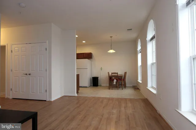 a view of a kitchen with a sink and a window