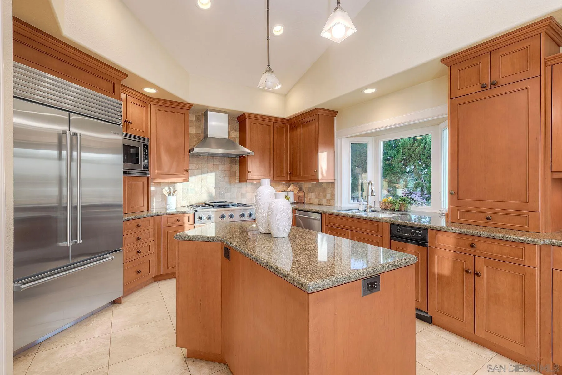 14036 Tierra Bonita Road Poway, CA 92064 - Photo 12 of 57 a kitchen with stainless steel appliances granite countertop a sink a stove and a refrigerator