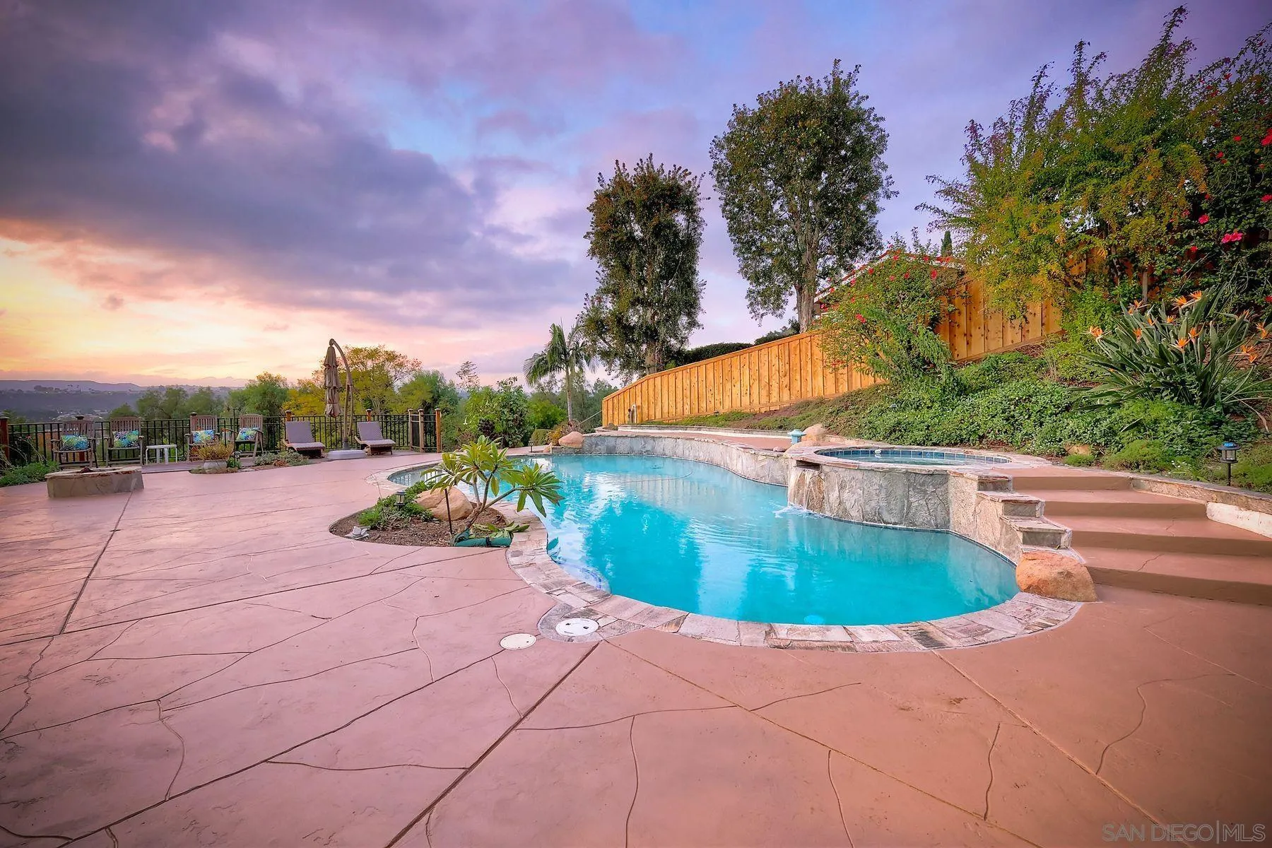14036 Tierra Bonita Road Poway, CA 92064 - Photo 17 of 57 a view of a swimming pool with an outdoor space and seating area