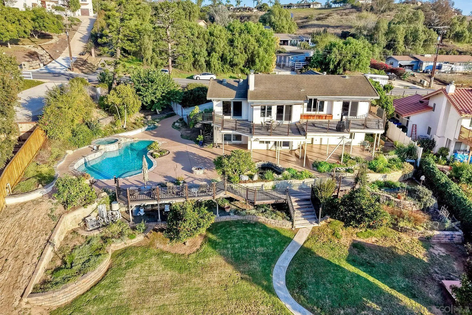 14036 Tierra Bonita Road Poway, CA 92064 - Photo 24 of 57 an aerial view of a house with swimming pool patio and outdoor seating