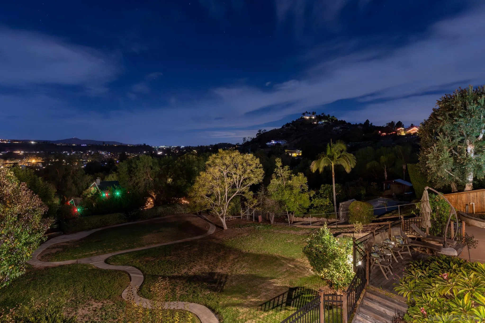 14036 Tierra Bonita Road Poway, CA 92064 - Photo 26 of 57 a view of a backyard of a house with a yard fire pit and outdoor seating