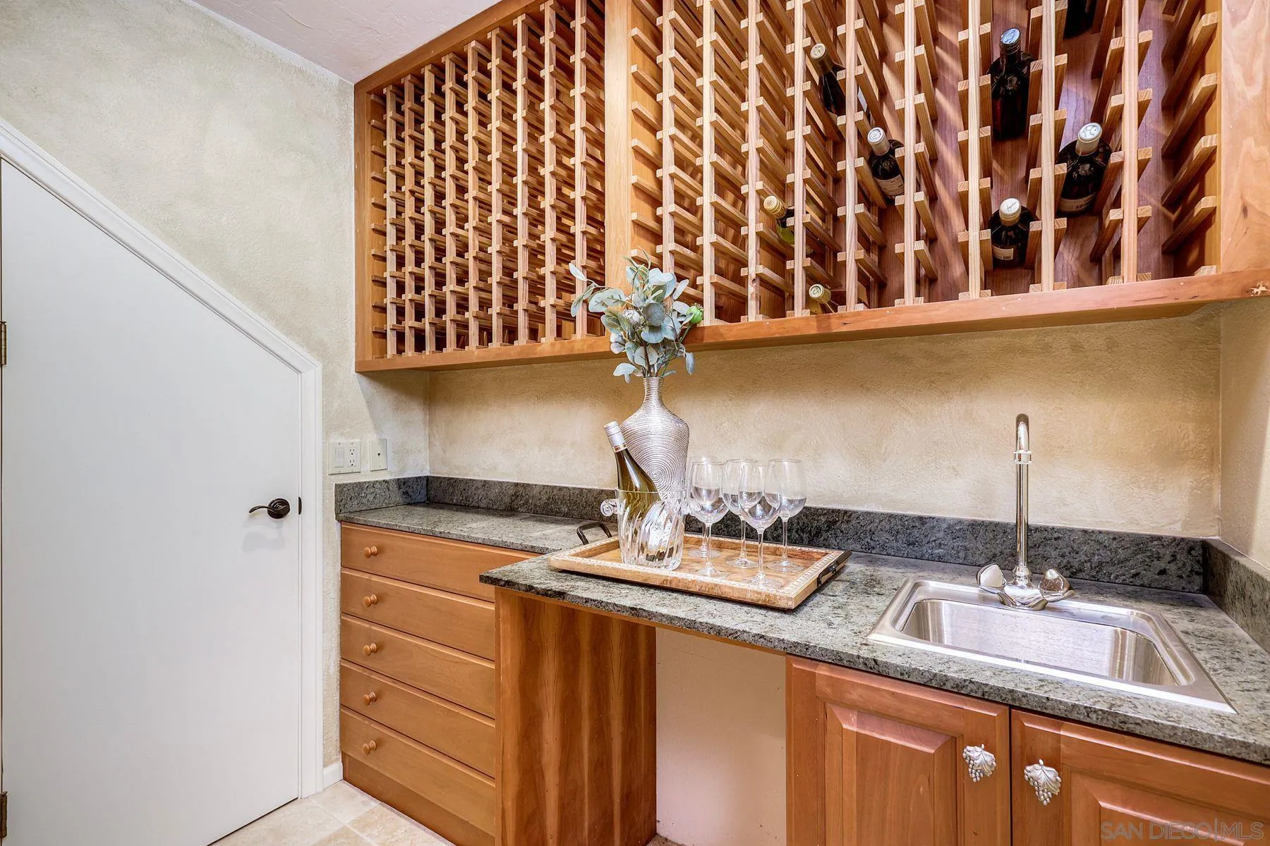 14036 Tierra Bonita Road Poway, CA 92064 - Photo 28 of 57 a kitchen with a sink and a granite top