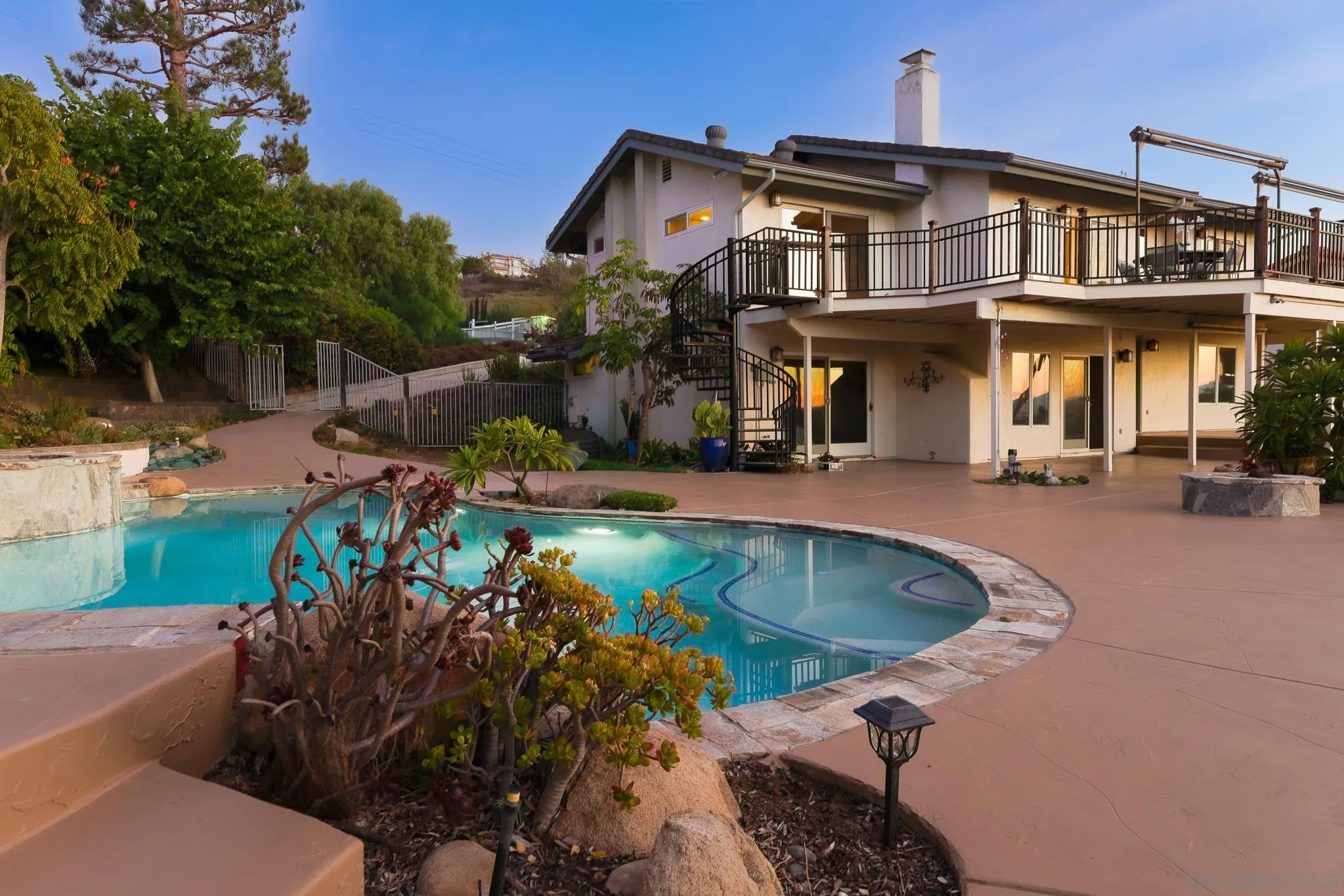 14036 Tierra Bonita Road Poway, CA 92064 - Photo 44 of 57 a front view of a house with a swimming pool